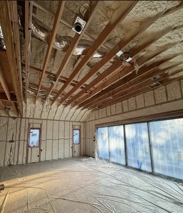 Interior walls and ceiling insulated with spray foam during new construction in New Gloucester